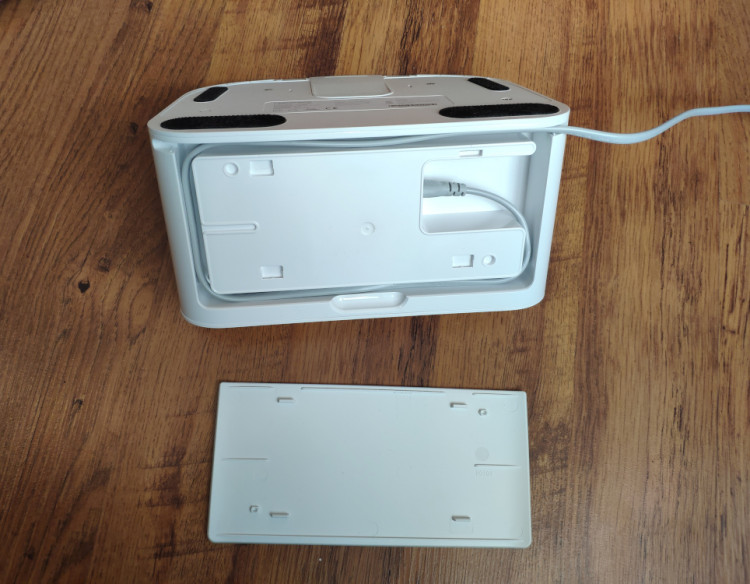 The charging dock hides a cable inside